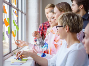 This is an image of a team looking at a Johari Window for a conversation