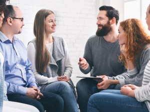This is a group of six people with soft skills talking in a close circle